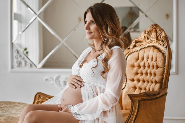 https://blog.metrobrazil.com/en/wp-content/uploads/sites/3/2021/05/young-beautiful-pregnant-woman-with-blond-hair-with-gentle-makeup-fashionable-lingerie-peignoir-sits-vintage-armchair-posing-luxury-interior_179135-1676-2.jpg